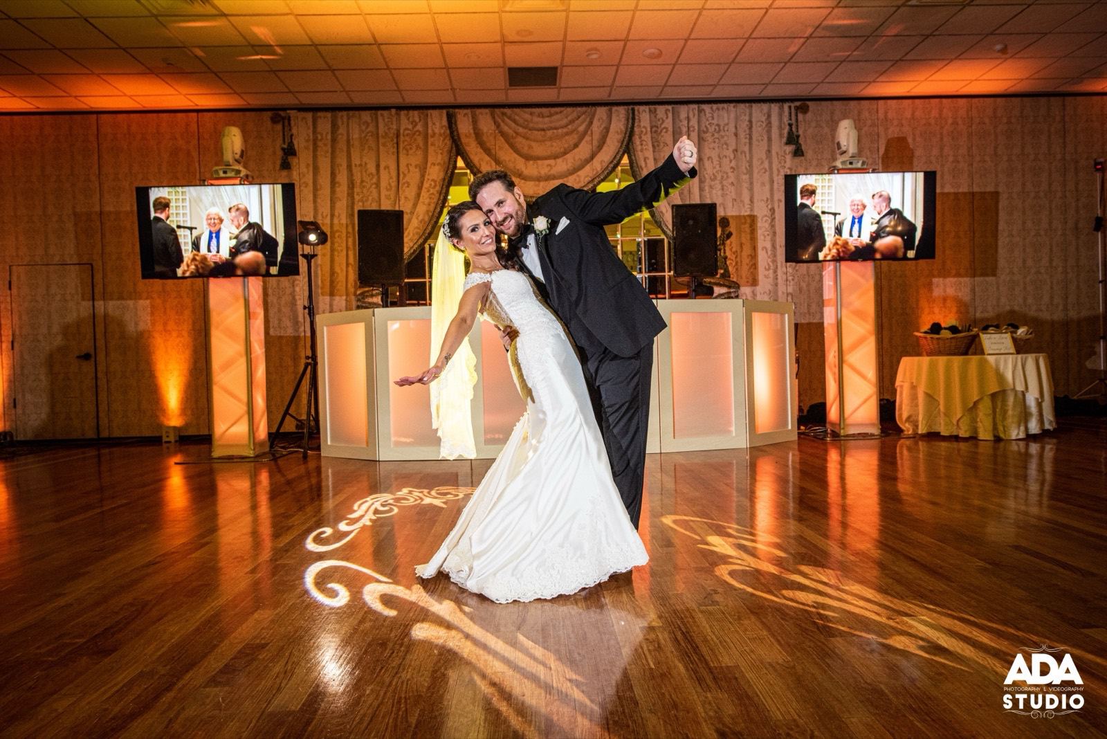 Couple under warm reception lighting