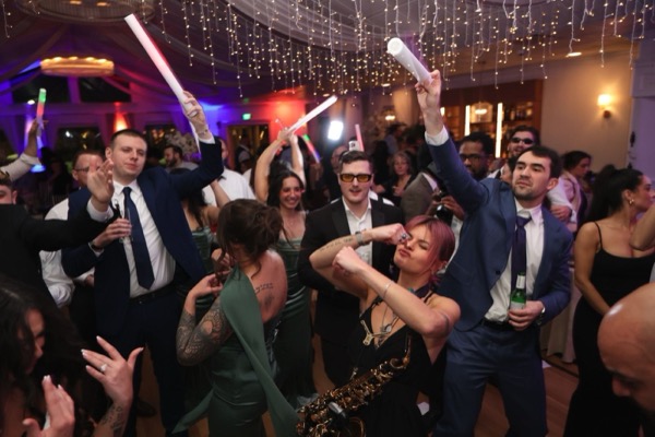 Crowd dancing with glow sticks