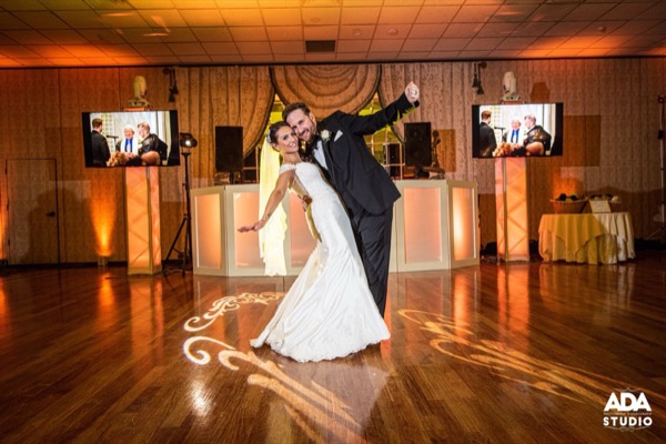 Couple under warm reception lighting